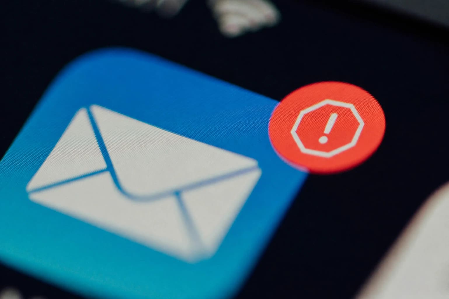 Email spam rate illustration showing a suspicious message, warning symbol, and sender reputation indicators