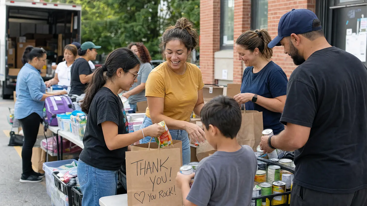 Local businesses and volunteers supporting a community event over Labor Day weekend