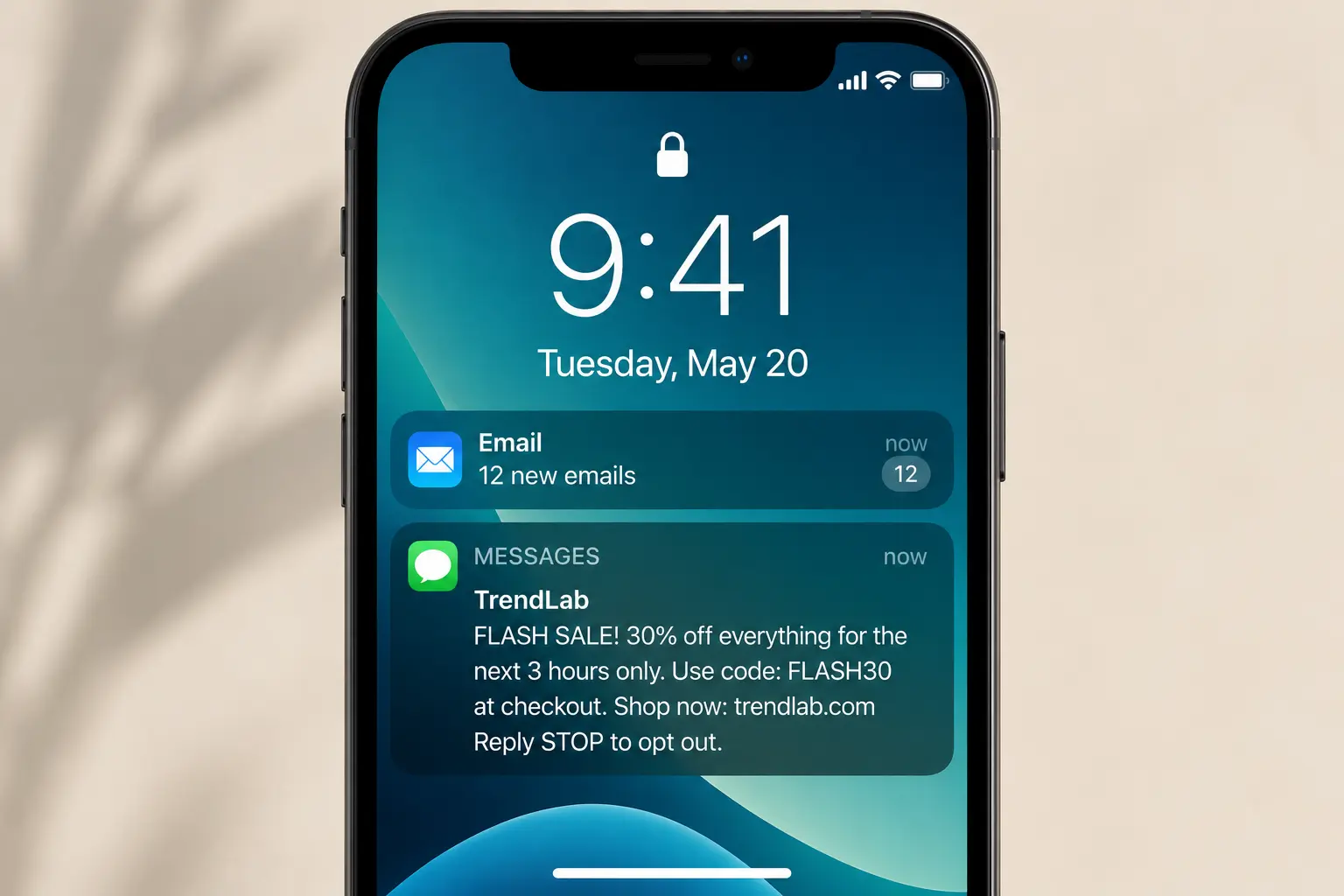 Phone lock screen where the email notification is collapsed to a count of 12 unread while the text message shows a flash sale offer, discount code and opt-out in full