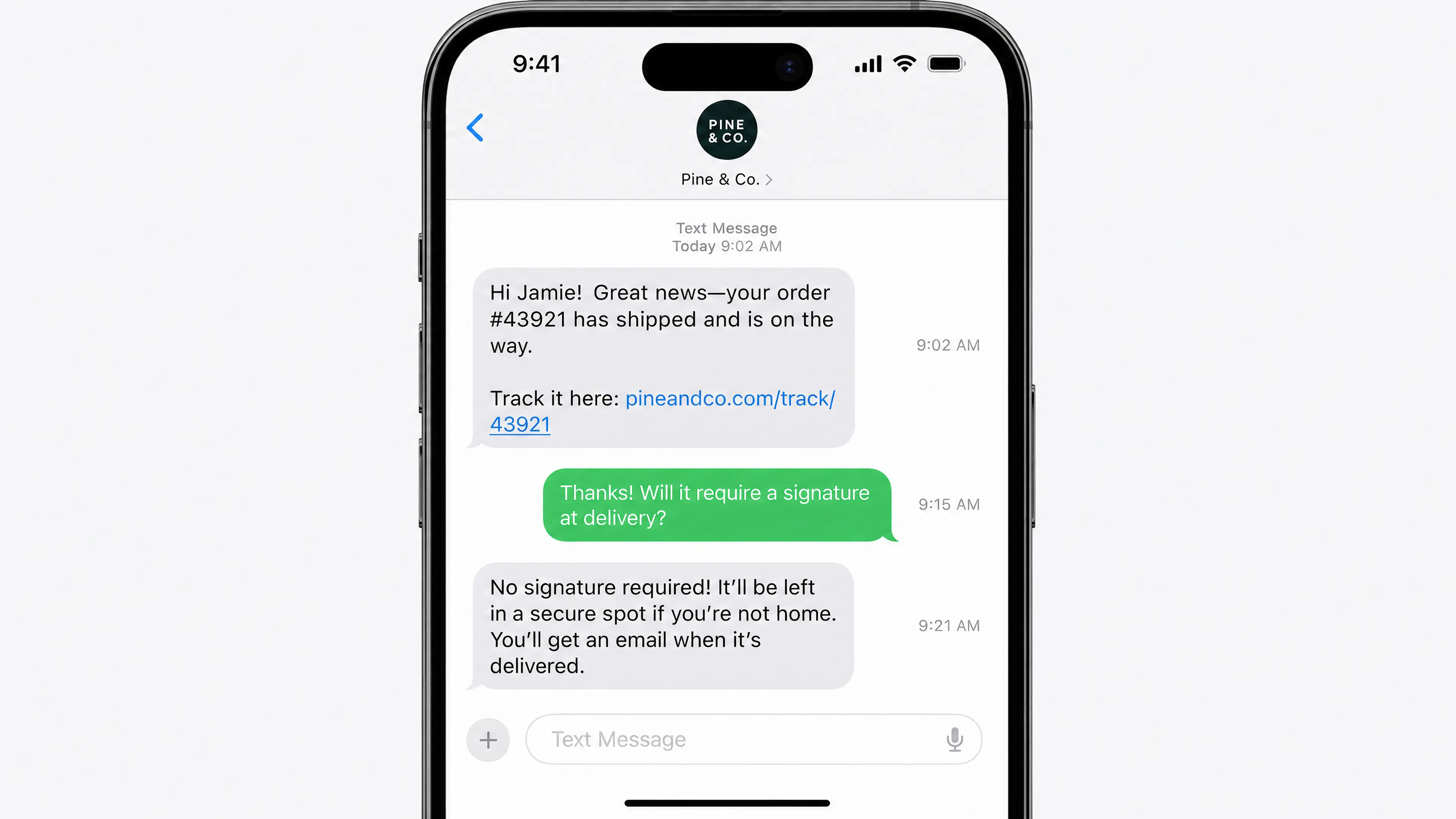 Phone showing a text thread where a store sends a shipping update with a tracking link, the customer asks whether delivery needs a signature, and the store replies that it does not